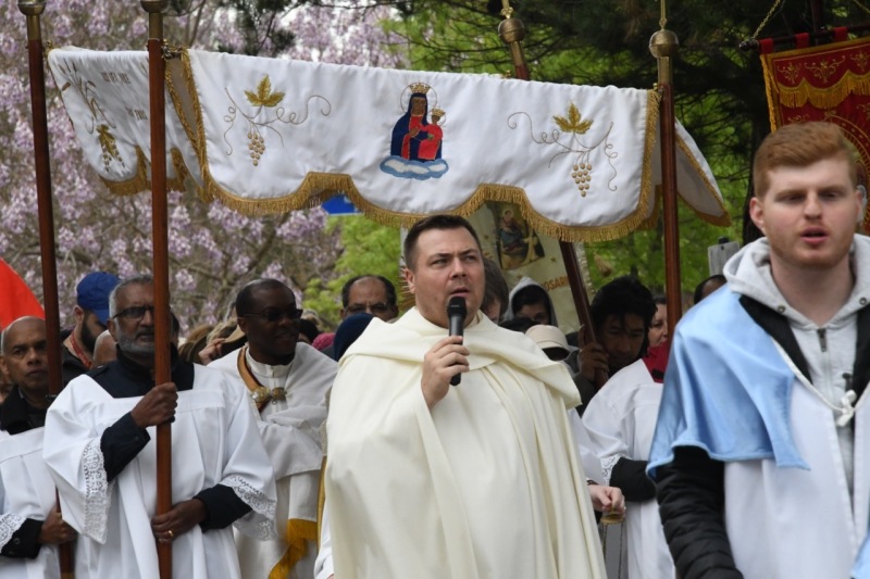 Fr Damian leading prayers during the Procession to the Grotto
