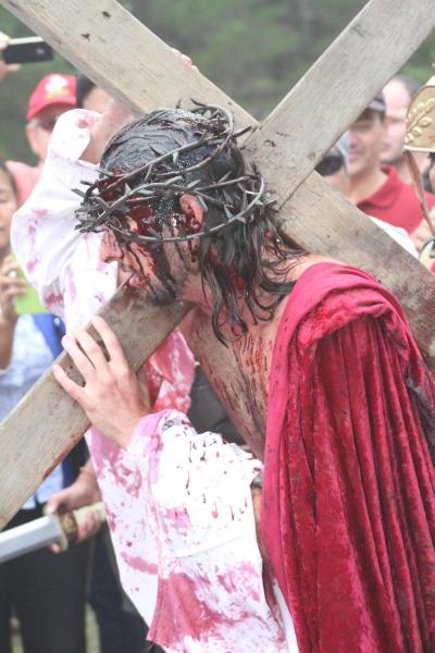 Jesus carries his Cross