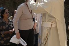 Fr. Anthony blessing a Pilgrim